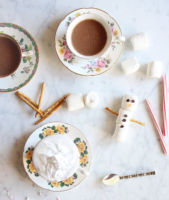 Hot cocoa and marshmallows on a table.