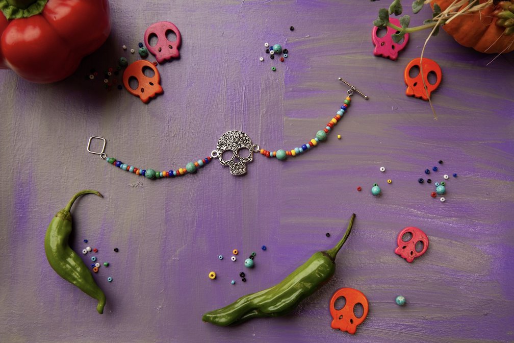 The day of the dead bracelet on a purple background.