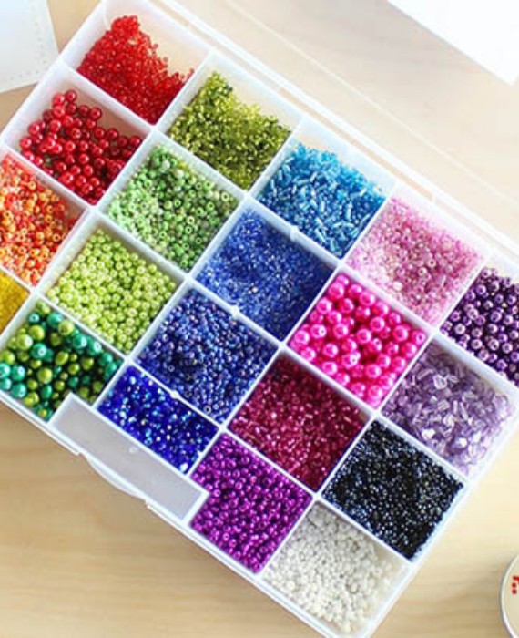 A plastic container filled with colorful beads.