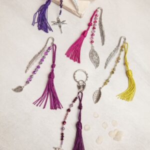 Tassels and beads on a white table.