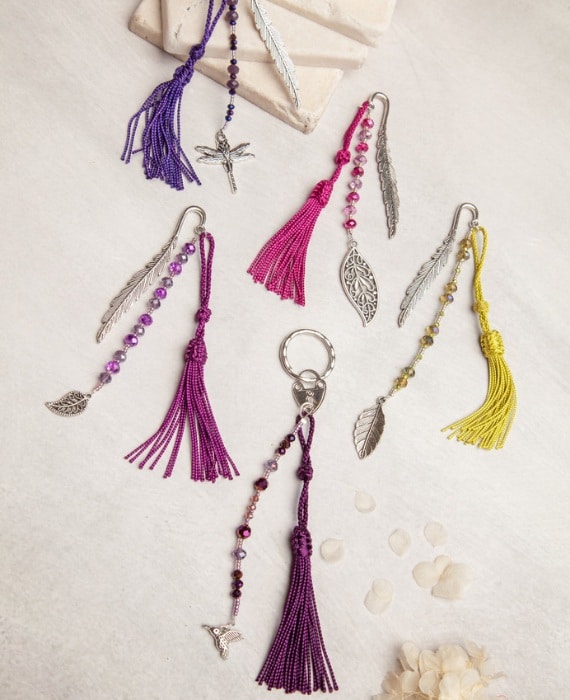 Tassels and beads on a white table.