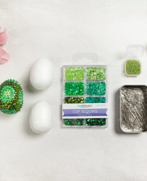A set of easter eggs, beads, and flowers.