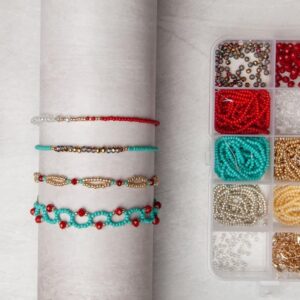A set of bracelets and beads on a table.
