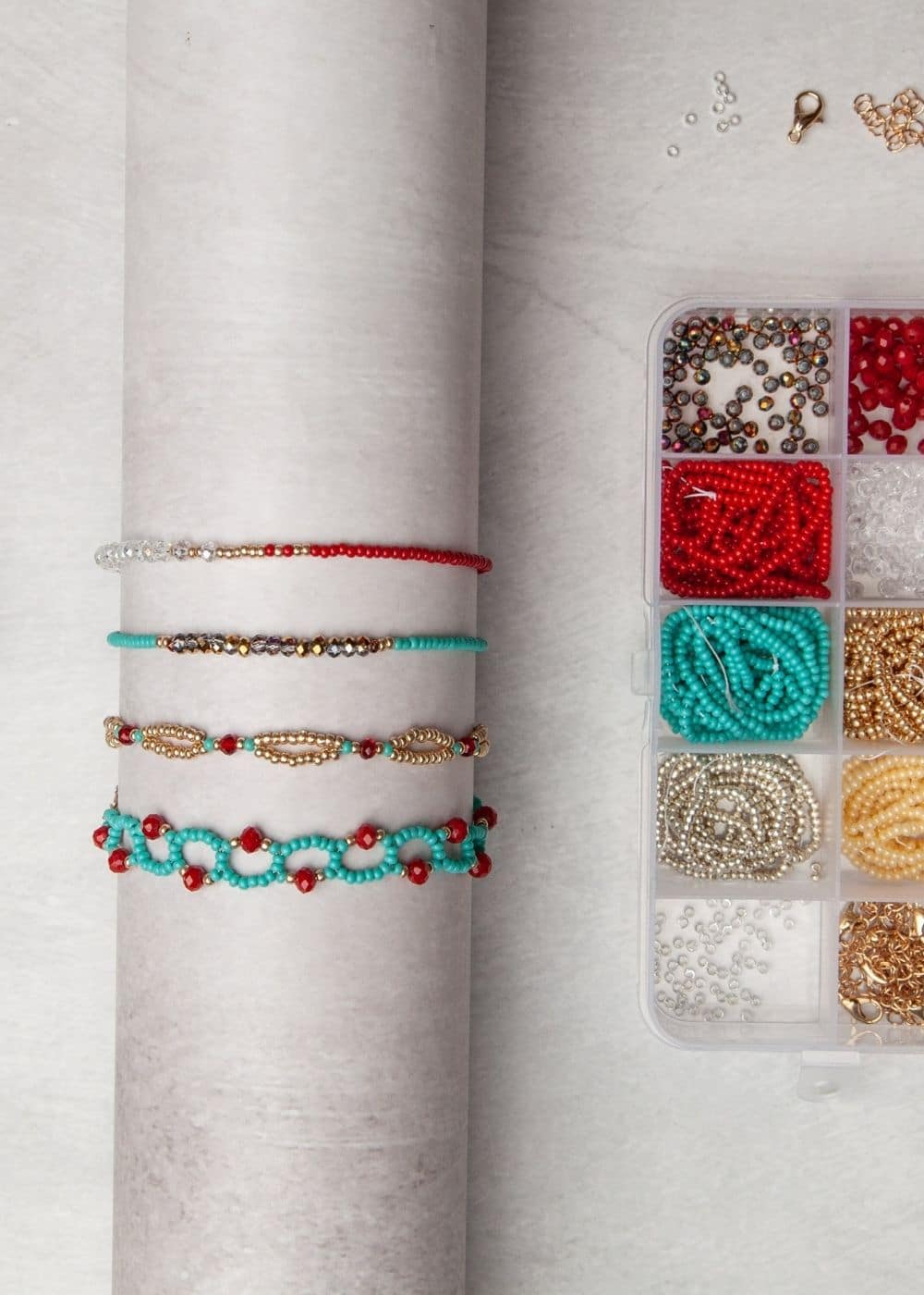 A set of bracelets and beads on a table.