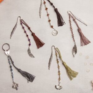 Tassels and charms on a notebook.