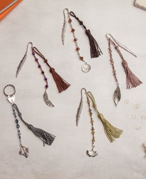Tassels and charms on a notebook.