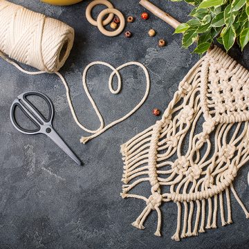 Macrame, handmade macrame for home decoration, creative hobby layout with accessories, top view